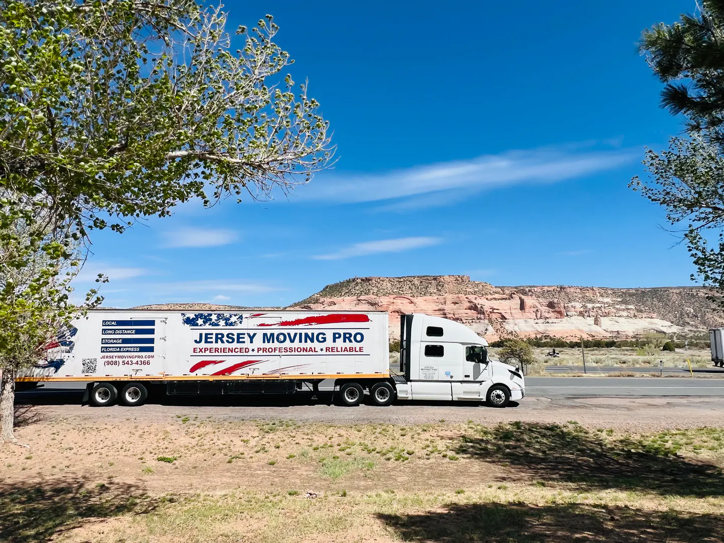 Jersey Moving Pro tractor-trailer parked beside a road